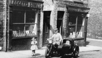 Photo 4  - Jim Burdett and Daughter Doris outside Leggetts Store, Lambton Street in 1946