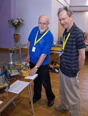 Photo 11  - 2015 Exhibition - Fred Thompson (NE Meccano Soc) demos operation to Mike Wheatley (WebMaster)