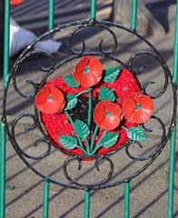 Photo 1  - 2024 Normanby Remembrance Day Service - Poppies on Railings of Remembrance Garden, Cleveland St