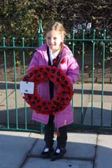 Photo 4  - 2024 Normanby Remembrance Day Service - Holding Wreath on Behalf of Normanby Primary School Staff and Children